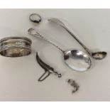 A silver preserve spoon, napkin ring, brooch etc.