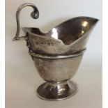 A good Georgian-style silver sauce boat on pedesta