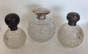 A group of three silver topped hobnail cut scent b