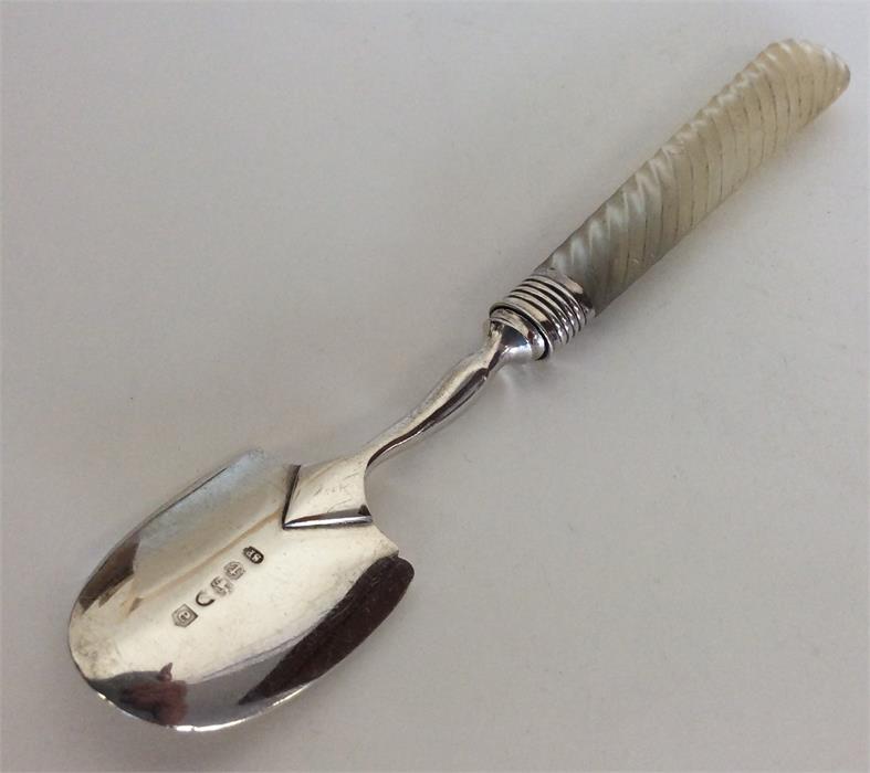 A small Georgian silver apple corer with MOP handl