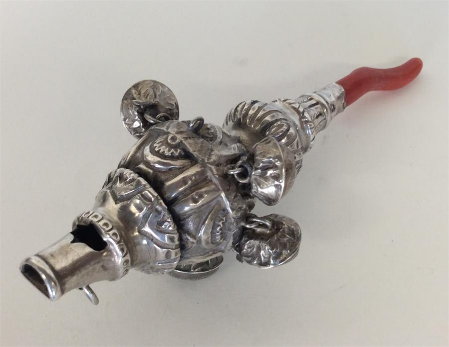 A Georgian silver rattle / teether embossed with f