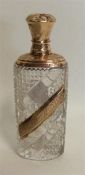 A small glass and gold mounted scent bottle with h