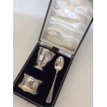 A cased three piece silver christening set compris