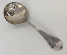 A Russian preserve spoon with silver gilt bowl and