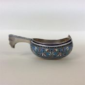 A Russian silver and enamel kovsh decorated with f