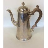 A Georgian silver tapering coffee pot with hinged