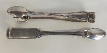 Two pairs of silver sugar tongs. London. By George