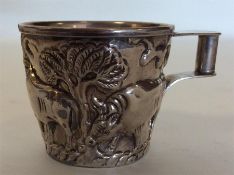 A Continental silver mug profusely decorated with