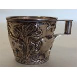 A Continental silver mug profusely decorated with