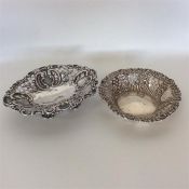 An embossed silver sweet dish decorated with scrol