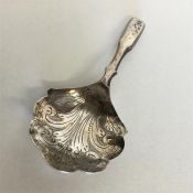 An early Georgian silver bright cut caddy spoon. B