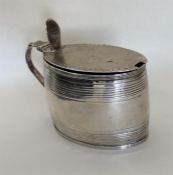 A good Georgian silver oval mustard with hinged to