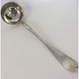 A large heavy silver Continental ladle with gilt b