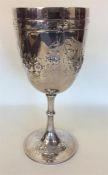 A large Victorian goblet embossed with flowers and