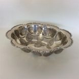 A heavy oval boat-shaped dish with scroll decorati