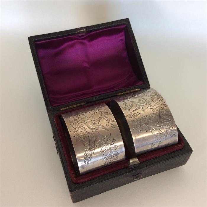 An attractive pair of silver napkin rings decorate