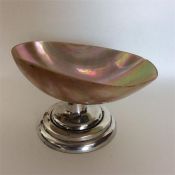 An unusual silver mounted and MOP bonbon dish on s