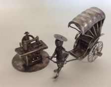 A Chinese silver miniature rickshaw together with