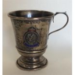 A small silver and enamel christening cup. Birming