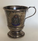 A small silver and enamel christening cup. Birming