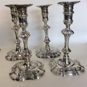 A heavy matched set of four George II silver candl