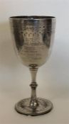 A Victorian silver goblet engraved with flowers an