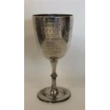 A Victorian silver goblet engraved with flowers an