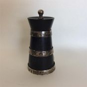 A silver and ebony pepper grinder. London. By J&D.
