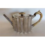 A small silver batchelors' teapot with reeded hand