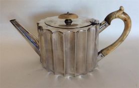 A small silver batchelors' teapot with reeded hand