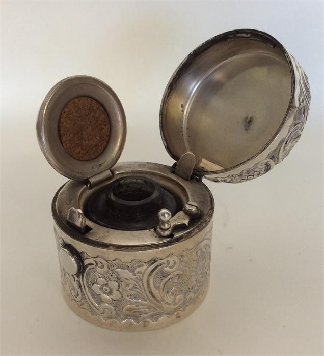 A heavy cylindrical embossed silver ink pot with s - Image 2 of 3