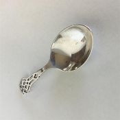 A Sterling silver pierced caddy spoon. Approx. 10