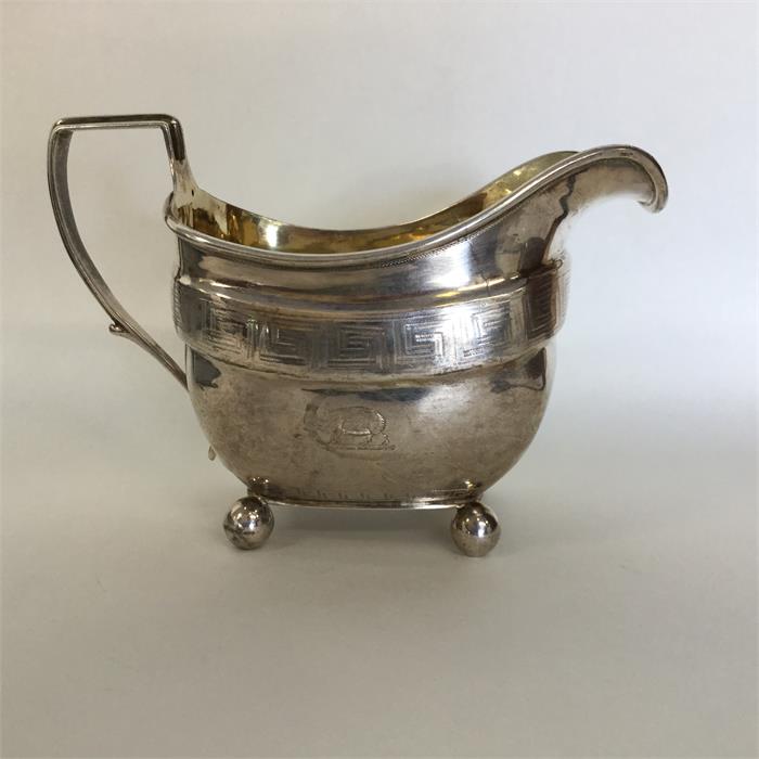 A good Georgian silver bright cut cream jug on bal - Image 2 of 3