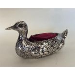 An unusual silver pin cushion in the form of a duc