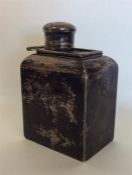 A Georgian-style silver tea caddy with slide-off c
