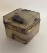 A small square silver and agate inkwell with hinge