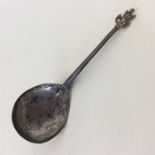 An early Continental spoon, the finial mounted wit