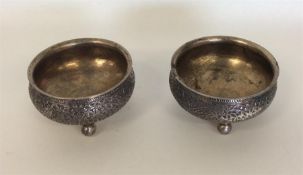 A heavy pair of Indian silver salts decorated with