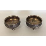A heavy pair of Indian silver salts decorated with