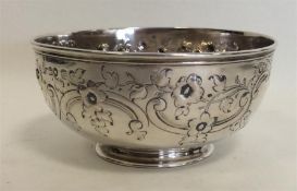 A small circular embossed silver sugar bowl attrac