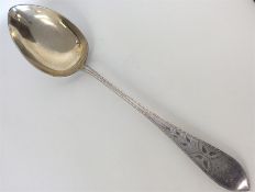 A massive Continental silver basting spoon decorat