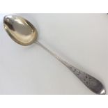 A massive Continental silver basting spoon decorat