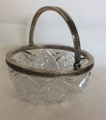 A Russian silver mounted bonbon dish with swing ha