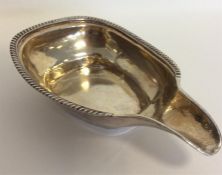 A Georgian silver pap boat with gilt interior and