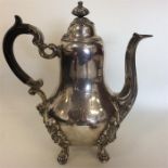 A heavy Continental silver water jug with scroll