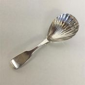 A large Victorian silver caddy spoon with fluted b