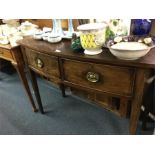 A mahogany bow front sideboard.