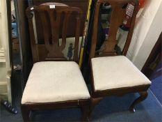 Two Antique mahogany dining chairs.