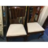 Two Antique mahogany dining chairs.