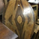 A walnut veneered tilt-top table.